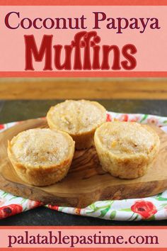 three coconut papaya muffins on a wooden platter with the title overlay