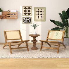 two wooden chairs sitting next to each other on top of a rug