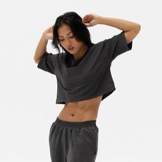 The Easy Crop Top is a must-have essential in your wardrobe. You will love our lightweight organic cotton crop top, which is perfect for your everyday basics. This piece is such a staple throw on our matching comfy sweats for a flawless street look or pair it with your favourite leggings or jeans. Ideal for in the gym and out on the streets. Made from our lightweight organic cotton. 95% organic cotton, 5% Elastane. Dyed with certified Eco-Friendly dyes. GOTS & OEKO-TEX® approved. All packaging is recycled or responsibly sourced. Versatile Everyday Crop Top, Athleisure Crop Top T-shirt For Loungewear, Basic Cropped T-shirt For Loungewear, Cotton Athleisure Cropped T-shirt For Workout, Basic Cropped Workout Crop Top, Relaxed Fit Cropped T-shirt, Relaxed Fit Cropped Hem Athleisure Crop Top, Cotton Cropped T-shirt For Loungewear, Spring Cropped T-shirt For Workout