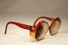 "Vintage 80s eyeglasses Christian Dior Optyl translucent orange color. High quality materials. Large frame with personality. They have a prescription lens that could be replaced. Frame Germany / Model: 2021-30 / Size: 54▢13-125. Ref: OB0030 CONDITION: Excellent DIMENSIONS: Bridge: 13 mm / 5,12\" Lens width: 54 mm / 21,26\" Lens height: 55 mm / 21,65\" Frame width: 134 mm / 52,76\" Temple length: 125 mm / 49,21\" More vintage items in my online shop: http://www.vintagecarwen.com" Orange Retro Sunglasses For Party, Dior Orange Bag, Luxury Orange Retro Sunglasses, Vintage Orange Shoulder Bag, Vintage Orange Sunglasses With Uv Protection, Vintage Orange Sunglasses With Mirrored Lenses, Luxury Orange Square Frame Sunglasses, Dior Vintage, Vintage Bags