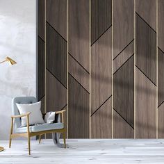 a living room with wood paneling and a chair in front of a wall mounted tv