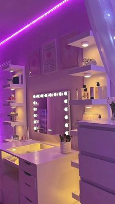 a bathroom with purple lighting and white furniture