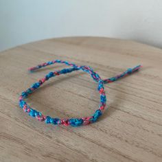 A Handmade Bracelet Or Anklet Woven With Shades Of Blue And Pink Colors. A Friendship Or Statement Bracelet Perfect For This Summer! Approx. 9 Inches/ 30 Centimeters Long. 10 Woven Bracelets For $25. Handmade Blue Friendship Bracelets For Everyday, Handmade Blue Friendship Bracelets, Pink Handmade Braided Bracelets For Everyday, Handmade Pink Braided Bracelets, Handmade Pink Friendship Bracelets For Crafting, Everyday Handmade Pink Braided Bracelets, Casual Pink Jewelry For Crafting, Gold Knot Bracelet, Horse Hair Bracelet