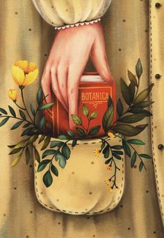 a painting of a woman's hand holding a book with yellow flowers on it