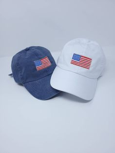 Show others your patriotic spirit with this vintage American flag cap.  Specifications: 100% cotton pigment dyed twill Unstructured, low-profile, six-panel Pre-curved visor Tri-glide buckle closure Vintage American Flag, Embroidered Hat, Embroidered Hats, Red White Blue, Trucker Cap, Low Profile, American Flag, 4th Of July, White Blue