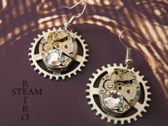 "Elegant Steampunkery! Vintage 17 jewel Watch mechanisms on a fixed gearwheel, featuring 2 stunning clear Swarovski Crystals. The findings are 925 Sterling silver. Lightweight, perfect for adding a touch of class to that steampunk, cosplay outfit, but understated enough to be used for everyday use! the choice is yours! Steamretro has a 100% feedback rating! When you buy from Steamretro you will receive a fantastic Handmade piece of jewelry, quite distinct from any other boutique! We offer FREE s Punk Style Round Earrings As Gift, Silver Steampunk Earrings, Steampunk Nickel-free Earrings As Gift, Steampunk Nickel-free Earrings For Gift, Steampunk Style Earrings As Gift, Steampunk Metal Earrings For Gift, Watch Mechanism, Earrings Gothic, Steampunk Watch