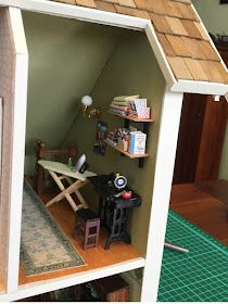 a doll house with furniture and accessories in it