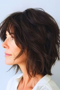 Save this pin for the best shag hairstyles for women over 50. This tapered shag cut is a sophisticated choice for older women who want a stylish look. The gradual layering provides a smooth transition from the crown to the ends, resulting in a polished, well-blended silhouette. Short Curly Hair With Bangs And Layers, 2024 Haircuts, Shaggy Layers, Shag Hair, Shag Cut, Thick Hair Cuts, Shaggy Short Hair, Swept Bangs