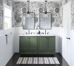 a bathroom with two sinks and mirrors on the wall