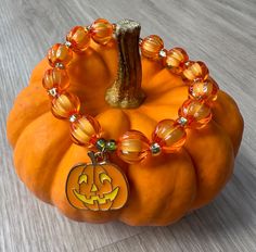 🕷️NEW FOR HALLOWEEN🎃 ✨PRODUCT DESCRIPTION The Pumpkin beaded bracelet from Beadbound Jewellery is a pretty orange bracelet accessory that is perfect for Halloween 🎃. Made by hand, the bracelet is made with alternating faceted acrylic orange beads and gold seed beads. It is finished with a spooky pumpkin enamel charm for added decoration. Please select your bracelet size when ordering. ✨PRODUCT CARE The beads are threaded onto elastic string so the bracelet will stretch to fit your wrist, but while care is taken to secure the beads, please don't overstretch them to avoid damage. Due to the bracelet being made with small beads it is not recommended for children under 3 years old. Prolonged exposure to water may fade or discolour the beads. ✨DELIVERY INFO I provide FREE UK 2nd class  deliv Halloween Novelty Orange Bracelets, Novelty Orange Bracelets For Halloween, Orange Beaded Bracelets For Halloween Gift, Orange Beaded Bracelets For Halloween, Halloween Orange Round Beads Jewelry, Halloween Orange Round Bead Jewelry, Orange Halloween Gift Bracelet, Handmade Orange Bracelets For Halloween, Orange Round Beads Jewelry For Halloween