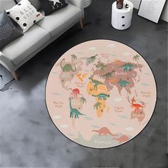 a rug with dinosaurs on it in front of a couch