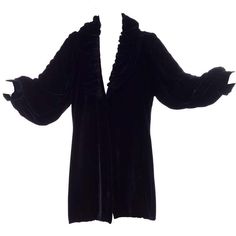 For Sale on 1stDibs - This is a gorgeous Edwardian vintage black velvet evening coat with a gathered puffy collar and puff sleeves. The coat is beautifully lined in pale pink Long Sleeve Velvet Outerwear For Costume, Long Sleeve Velvet Costume Outerwear, Elegant Velvet Outerwear For Costume, Silk Long Coat For Evening, Victorian Long Sleeve Formal Outerwear, Victorian Long Sleeve Outerwear For Formal Occasions, Elegant Velvet Evening Outerwear, Elegant Evening Velvet Outerwear, Vintage Velvet Costume Outerwear