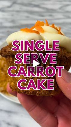 someone is holding up a carrot cake with cream on top and the words single serve carrot cake above it