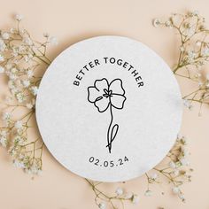 a white paper with a flower and the words better together on it next to some flowers