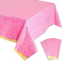 pink table cloth with yellow border and matching napkins