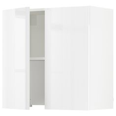 an open white cabinet with doors and shelves