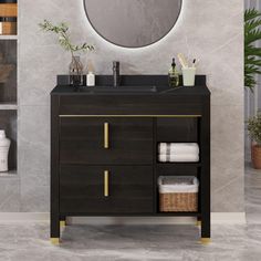 a bathroom vanity with a round mirror above it and towels on the bottom shelf next to it