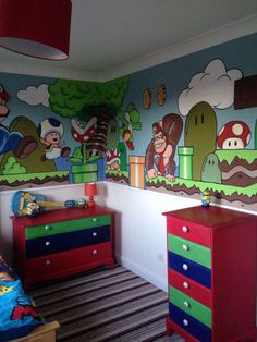 a child's bedroom decorated with mario bros wallpaper and colorful dressers in the foreground