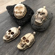 Unique and powerful double sided pendant, made with a skull made out of carved bone, and unique alloy metal designs around it and on its back. The back of the pendant has an embossed flower. The Pendant comes with a black leather cord, but you may choose to wear it with any chains that you already have as the bail is 1cm- 0.40 inch in diameter. The skull pendant itself is 5cm- 2 inch long 2.5cm- 1 inch wide A unique addition to your jewelry collection ⚡️GET 20% OFF by joining Akashi's VIP List ⚡ Halloween Skull Jewelry In Bone Color, Halloween Skull Shaped Bone Jewelry, White Skull Jewelry For Day Of The Dead, Skull-shaped Bone Jewelry For Gifts, Bone-colored Skull Jewelry For Gift, Skull Shaped Bone Colored Jewelry For Gifts, Bone Color Skull Jewelry For Gifts, Unique Carved Bone Jewelry, Unique Bone-colored Carved Jewelry