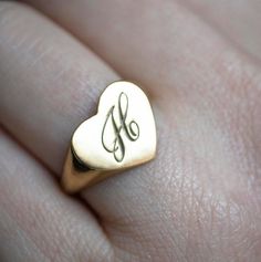 The heart signet ring is a classic, and this one is personalized with an inset monogram. This item is engravable with text or monogram of your choice at no extra cost. The initals are engraved onto the ring and embedded in the 3D model for a flawless embossed finish. You may choose to customize this ring with different images, letters or words. A render of your custom design will be sent to you before production. A gemstone on this ring is also possible, please inquire for pricing details and op Classic Heart-shaped Sterling Silver Engraved Ring, Classic Heart-shaped Engraved Sterling Silver Ring, Classic Sterling Silver Heart-shaped Engraved Ring, Classic Sterling Silver Heart Engraved Ring, Classic Heart-shaped Signet Ring For Wedding, Heirloom Engraved Heart Ring, Classic Jewelry For Valentine's Day, Minimalist Personalized Heart Initial Ring, Minimalist Personalized Engraved Ring For Valentine's Day