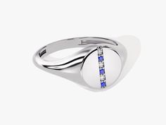 a white gold ring with blue and white stones on the side, set in 18k white gold