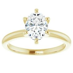 a yellow gold engagement ring with an oval cut diamond