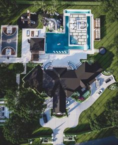 an aerial view of a house with a swimming pool