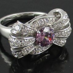 ***********Final Sale - Price Is Firm*************** Jean Dousset 3ct Absolute Simulated Diamond Lavender-Color Sterling Silver Bow Ring *Size 7 Measures Approx. 1/2" Long X 3/4" Wide *Sterling Silver - Stamped .925 *Boxed Elegant Purple Platinum Rings, Elegant Purple Diamond Ring For Formal Occasions, Elegant Purple Diamond Ring For Anniversary, Belly Button Piercing Rings, Jean Dousset, Full Finger Rings, Dainty Wedding Ring, Black Stone Ring, Freshwater Pearl Ring