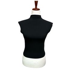 This Madewell Black Sleeveless Tank Top Features A Turtleneck Neckline And A Form-Fitting Design. Made Of Stretchy Knit Fabric Material, It Offers A Minimalist And Sleek Look. Perfect For Layering Or Wearing On Its Own, This Tank Top Is A Versatile Addition To Any Wardrobe. The Muscle Tee Style Adds A Trendy Touch To Your Outfit. The Label Has Been Marked Through To Prevent Attempted Store Returns. No Stains, Snag Or Holes. Laying Flat: Pit To Pit 15.25" Without Stretching Length 18.25" Black Tank Top Women, V Neck Tank Top, Muscle Tee, Black Turtleneck, Muscle Tees, Sleek Look, Black Sleeveless, Sleeveless Tank Top, Sleeveless Tank