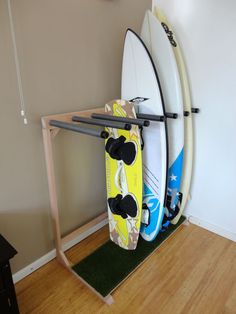 two surfboards are propped up against a rack