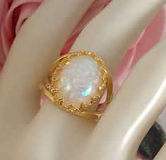 Stunning Vintage Opal Gold Filled Dress Ring Ring size R  - the inside diameter of the ring band is 1.86 cm across (this is a large ring size) The beautiful Opal is 1.7 cm long and 1.2 cm wide and sits 8 mm high and is securely claw set Stamped S925. Total weight is 4.40 grams A stunning Cocktail Ring, in excellent condition, with minimal wear Box for display purposes only Customs and import taxes Buyers are responsible for any customs duties and import taxes charged by their respective Governme Cabochon Rings For Anniversary, Cabochon Opal Open Ring For Anniversary, Open Ring Opal Cabochon For Anniversary, Open Opal Ring With Cabochon For Anniversary, Cabochon Open Ring For Anniversary, Deco Dress, Art Deco Dress, Large Ring, Dress Rings