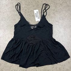 New W/ Tags Urban Outfitters Babydoll Tank Size: Small Color: Black Never Worn, Perfect Condition Babydoll Fit With A Low Cut And Sheer Lacey Detail Smoke Free Home! Ships Next Day! Black Tops With Built-in Bra For Daywear, Black Top With Built-in Bra For Daywear, Daywear Tops With Built-in Bra In Black, Black Lace Trim Top For Loungewear, Black Cami Tank Top For Daywear, Black Cami Top For Daywear, Black Cami For Daywear, Black Spaghetti Strap Tops For Daywear, Pink Flannel Shirt