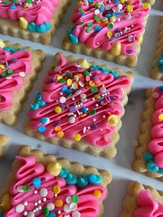 decorated cookies with pink icing and sprinkles