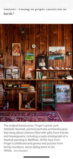 an old fashioned desk with pictures on the wall and other items in front of it