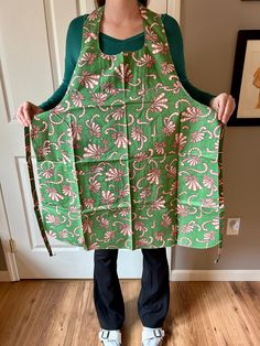 a woman holding an apron in front of her face