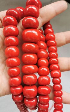 material:natural stone with heat treated coral color quantity:one strand 22inch=57-60pcs size:approx.7X10-17X22mm note:have larger stock and offert wholesale price. Orange Red Coral Beads For Jewelry Making, Red Beaded Necklaces With Natural Stones, Red Coral Jewelry With Natural Stones In Round Beads, Red Necklaces With Natural Stone Round Beads, Red Necklaces With Natural Stones And Round Beads, Red Coral Beads For Jewelry Making, Large Red Coral Beads For Jewelry Making, Red Coral Gemstone Beads Necklace, Handmade Round Red Coral Beaded Necklaces