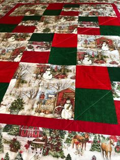 a quilted table cloth with christmas scenes on it