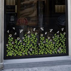 an image of a window decorated with flowers