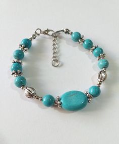 Turquoise silver bracelet Victorian bracelet Royal style bracelet Turquoise Antique style bracelet boho bracelet bohemian bracelet wife gift Turquoise bracelet Royal style bracelet Antique style bracelet Victorian filigree silver tone large oval Turquoise and round Tibetian turquoises and silver tone beads Unique bracelet . Silver-tone bracelet . Gemstone Boho bracelet . Bohemian bracelet . Vintage style bracelet. Antique style bracelet . Oriental style Princess style bracelet. Edwardian style bracelet. Turquoise jewelry. This bracelet is adjustable with plus 3.5 cm chain . For any size. We have a jewelry set earrings and necklace matching with this bracelet in that  listing. https://www.etsy.com/listing/1216660856/turquoise-set-silver-jewelry-set?click_key=9be094aefd185b7e21933578ba08fe62 Turquoise Bracelets With Silver Beads, Sterling Silver Bracelets With Turquoise And Silver Beads, Turquoise Sterling Silver Bracelets With Silver Beads, Nickel Free Bohemian Bracelets, Turquoise Bracelet With Silver Beads, Nickel-free Bohemian Bracelets, Bohemian Turquoise Beaded Nickel-free Bracelets, Bohemian Bracelets With Silver Beads, Bohemian Turquoise Beaded Bracelets With Silver Beads