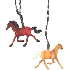 two plastic horses are shown in the same color and pattern as they walk together on leashes