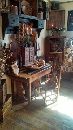 a room filled with lots of wooden furniture and decor on top of hard wood flooring