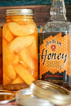 jars filled with honey sitting on top of a table