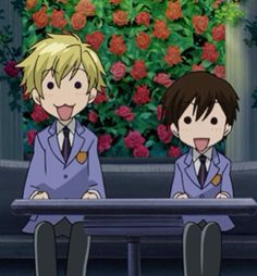 two anime boys sitting at a table with roses in the background and one boy sticking his tongue out