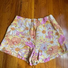 Light Yellow Linen Shorts With Hot Pink Orange And White Floral Pattern. With Pockets Washed But Never Worn Multicolor Floral Print Cotton Shorts, Yellow Bottoms With Floral Print For Spring, Yellow Floral Print Vacation Bottoms, Spring Printed Short Bottoms, Yellow Floral Print Shorts, Multicolor Cotton Bottoms For Day Out, Yellow Floral Print Beach Shorts, Yellow Floral Print Bottoms For Spring, Vacation Yellow Floral Print Bottoms