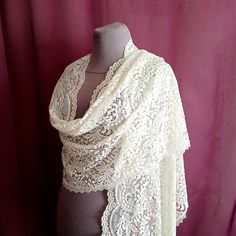 A large ivory scarf is made of amazingly soft and high-quality solid elastic lace. The edges of the scarf are trimmed with a lace border. Delicate ivory shawl has a rectangular shape. The dimensions of the scarf are 59 x 19 inches (150 x 48 cm). It is possible to make a mantilla according to the dimensions you specify. The shawl will be a wonderful gift. Color rendering may differ depending on the monitor settings. I sew unique shawls in small batches, by hand and exclusively for you. The scarf Cream Shawl Scarf For Wedding, White Lace Shawl With Lace Work, Lace Shawl Scarves For Wedding, Lace Shawl Scarf For Weddings, Cream Bohemian Scarf For Wedding, White Lace Shawl With Lace Trim, Lace Shawl For Weddings, Lace Wedding Scarf Shawl, Lace Wedding Shawl Scarf