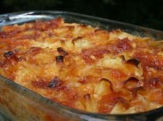 a casserole dish with pasta and meat in it