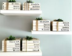 three wooden boxes with names on them sitting on top of a shelf next to each other