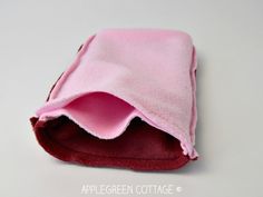 a pink and red blanket folded on top of each other