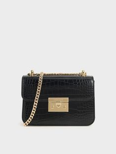 Thanks to its classic cut, this black mock-croc crossbody bag with a chain handle strap will be one you'll look forward to bringing everywhere. Plus, the push-lock closure promises ease of use. Team it with anything from pantsuits to flowy dresses. Black Joggers Outfit, Charles And Keith Bags, Charles And Keith, Leather Joggers, Joggers Outfit, Chain Strap Bag, Charles Keith, Black Joggers, Bag Trends