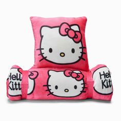 a pink hello kitty chair with four pillows on the back and one pillow that says hello kitty